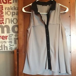 Sleeveless button up, grey sheer blouse.